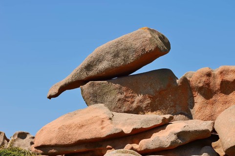 Granite rock in the shape of a bottle on the Cote de Granit Rose coast near Ploumanac'h,