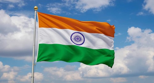 The Indian flag, a symbol of national pride, billows in the wind, showcasing its vibrant colors