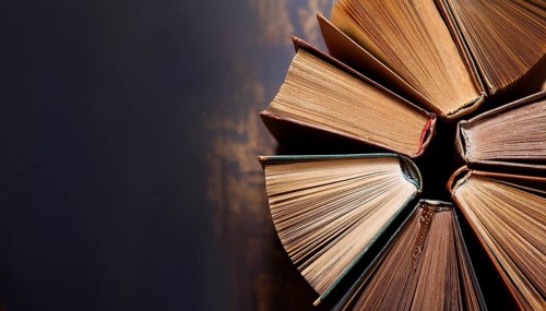 Old books arranged highlighting their historical significance. Neatly arranged representing a