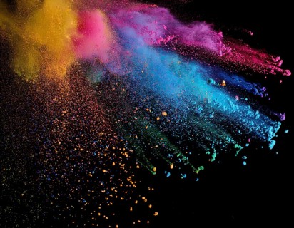 A colorful explosion powder on black background.. Multicolored powder explosion, AI generated