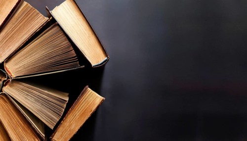 Old books arranged highlighting their historical significance. Neatly arranged representing a