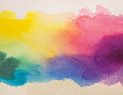 Bright watercolor art showcasing vibrant hues blending with artistic paint splashes, perfect for