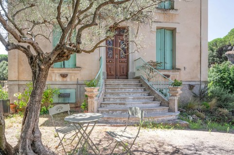 Typical Midi architecture in the south of France: a rustic stone staircase with ornate banisters