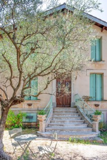 Typical Midi architecture in the south of France: a rustic stone staircase with ornate banisters