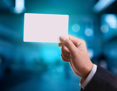 Hand holding a sheet of paper in hand.. AI generated image, ai