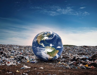 Visually striking scene depicting Earth placed amidst a landfill, illustrating environmental
