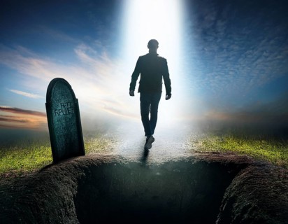 A silhouette of a lone figure walking off a gravestone, The scene evokes Resurrection thoughts
