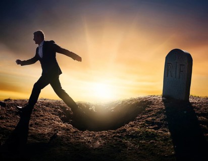 A silhouette of a lone figure walking off a gravestone, The scene evokes Resurrection thoughts