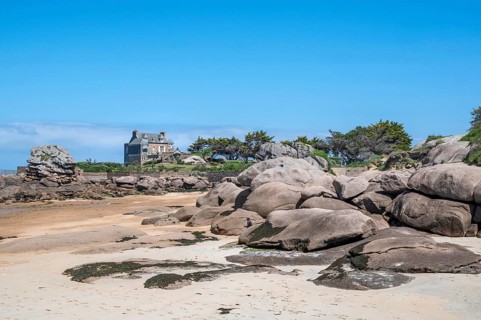 View from the harbour beach of Trégastel on the Côte de Granit Rose at low tide over the iconic