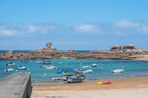 On the harbour beach of Tregastel on the Cote de Granit Rose, small sailing boats are moored next