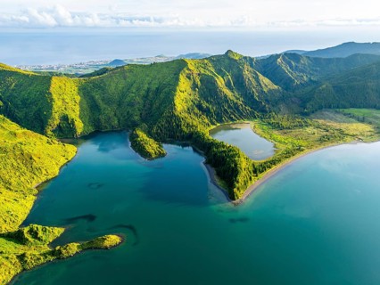 Lagoa do Fogo Lake on Sunny Morning. Green Lush Hills, Mountains and Atlantic Ocean. Azores, Sao