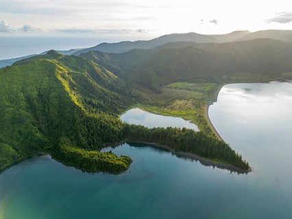 Lagoa do Fogo Lake on Sunny Morning. Green Lush Hills with Forest and Mountains. Azores, Sao Miguel