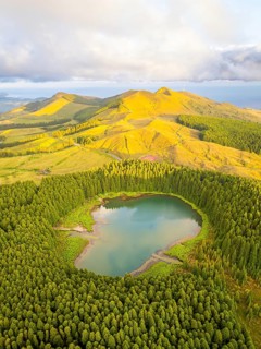 Hills, Forest and Lake Lagoa do Canario at Sunset. Azores, Sao Miguel Island, Portugal. Aerial View