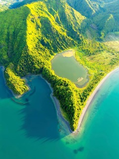 Lagoa do Fogo Lake on Sunny Morning. Green Lush Hills with Trees. Azores, Sao Miguel Island.
