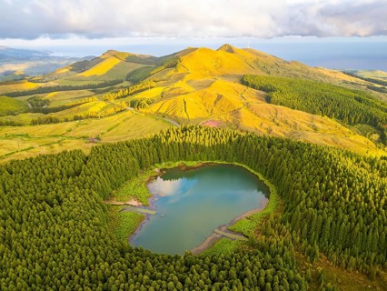 Hills, Forest and Lake Lagoa do Canario at Sunset. Azores, Sao Miguel Island, Portugal. Aerial View