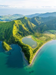 Lagoa do Fogo Lake on Sunny Morning. Green Lush Hills and Mountains. Azores, Sao Miguel Island.