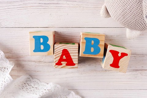 Cubes with letters Baby on a rustic background