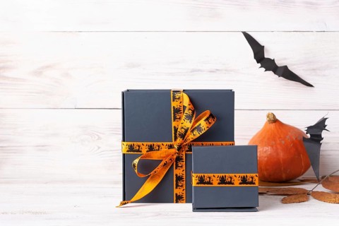 Halloween gifts pumpkin black paper bats copy space