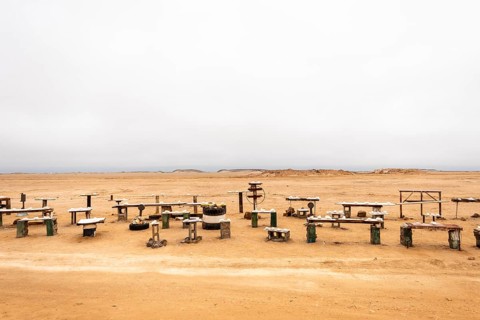 Pink salt displayed on wooden stands along the road to Namib-Naukluft National Park and Sandwich