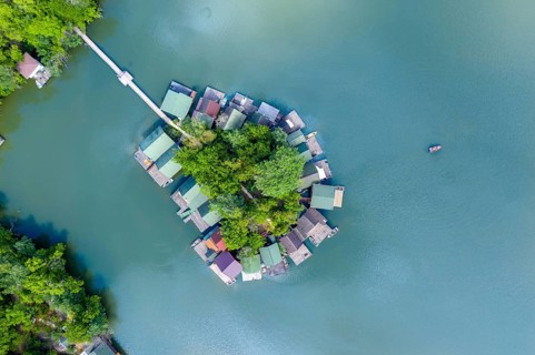 Drone, drone, aerial, from above, topview, topdown, island, lake, settlement, resort, green, blue,