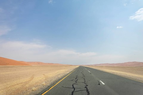Inside Sossusvlei, gravel roads wind through red dunes to Deadvlei, Big Daddy, and Sesriem Canyon,