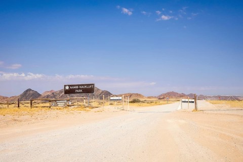 Entrance gate of Namib-Naukluft Park in Namibia - 27 August, 2025: with mountains in the background
