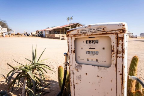 Old rusty fuel pump in Solitaire, Namibia - 27 August, 2025: set in a desert landscape with cacti,