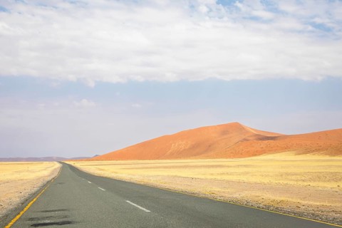 Inside Sossusvlei, gravel roads wind through red dunes to Deadvlei, Big Daddy, and Sesriem Canyon,