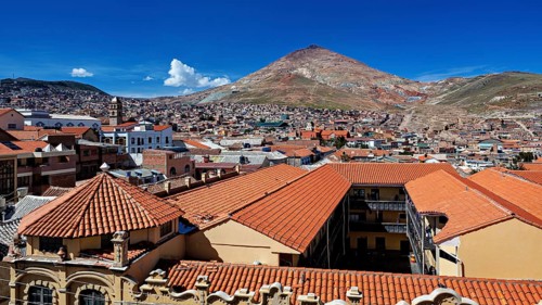 Red tiled roofs with a mountain view in the background on a clear day, the Cerro Rico silver