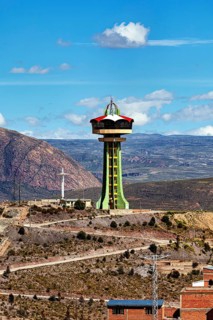 Large observation tower on a hill with sweeping views of the mountains and sky, the water tower of