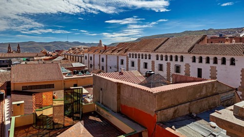 Urban view with tiled roofs under a clear blue sky, The streets of the historic centre of Potosi in