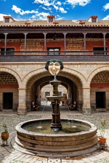 Historic courtyard with decorative fountain and arcades, The courtyard with fountain in the museum