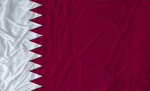 Qatar flag with fabric texture waving. Close up of flag of Qatar with cloth texture