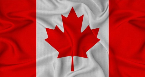 Canada flag waving with fabric texture. Close-up of the Canada flag waving with fabric texture