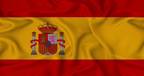 Spain flag waving with fabric texture. Close-up of the Spain flag waving with fabric texture
