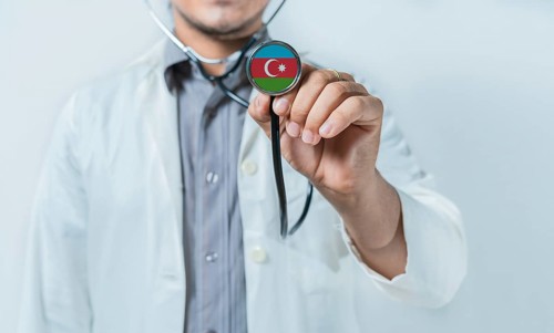 Azerbaijan national healthcare. Doctor showing stethoscope with Azerbaijan flag