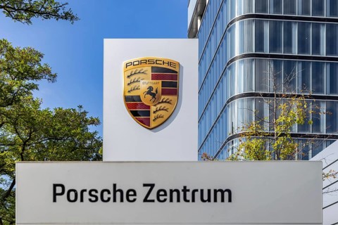 Porsche Centre Autohaus am Pragsattel. Porsche Design Tower skyscraper. Logo on a stele. Stuttgart,