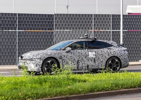 Prototype with camouflage livery on the road in Stuttgart. Zeekr Model 007 electric vehicle from