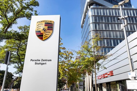 Porsche Centre Autohaus am Pragsattel. Porsche Design Tower skyscraper. Logo on a stele. Stuttgart,