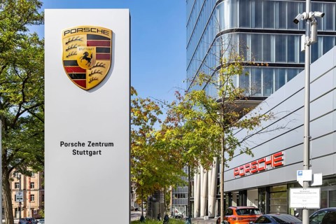 Porsche Centre Autohaus am Pragsattel. Porsche Design Tower skyscraper. Logo on a stele. Stuttgart,