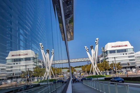 Porscheplatz with Porsche headquarters. Inspiration 911 artwork by Gerry Judah: three steles, each