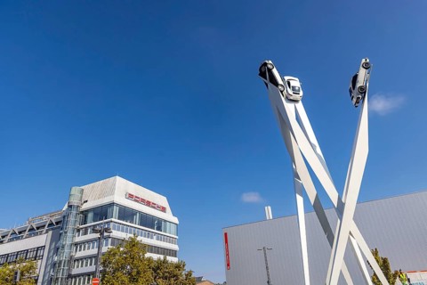 Porscheplatz with Porsche headquarters. Inspiration 911 artwork by Gerry Judah: three steles, each