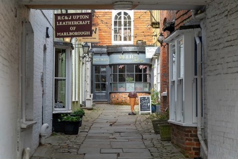 Specialist shops in historic alleyway of Old Hughenden Yard off the High Street in Marlborough,