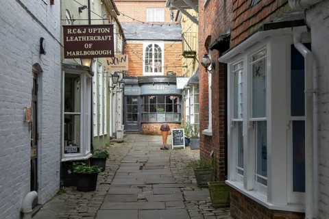Specialist shops in historic alleyway of Old Hughenden Yard off the High Street in Marlborough,