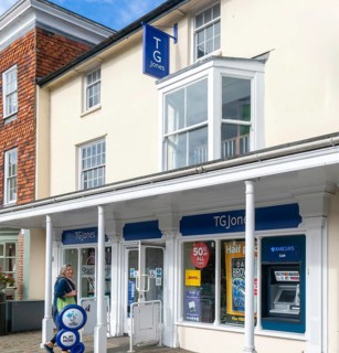 TG Jones shop signage rebranded WH Smith store, High Street, Marlborough, Wiltshire, England, UK