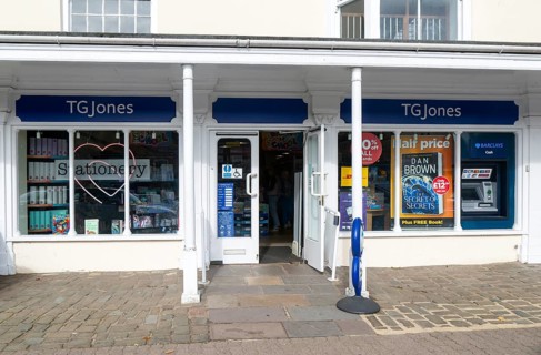 TG Jones shop signage rebranded WH Smith store, High Street, Marlborough, Wiltshire, England, UK