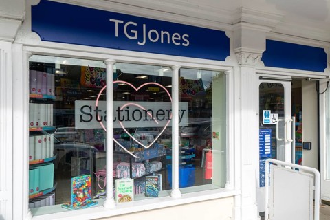 TG Jones shop signage rebranded WH Smith store, High Street, Marlborough, Wiltshire, England, UK