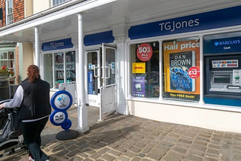 TG Jones shop signage rebranded WH Smith store, High Street, Marlborough, Wiltshire, England, UK