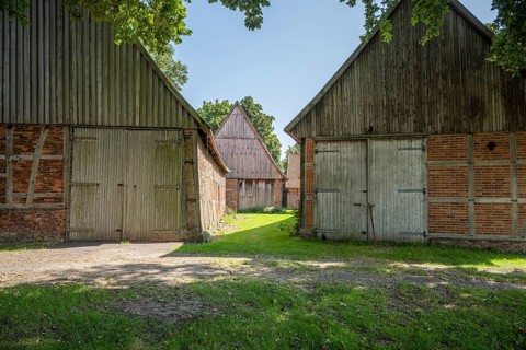 Ancient half-timbered houses with wooden and brick façades in the shade, Weser cycle path,