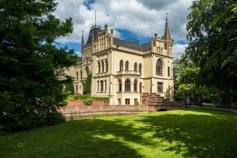 A Gothic castle with towers and lawns in summery surroundings, Schloss Evenburg, Leer, East Frisia
